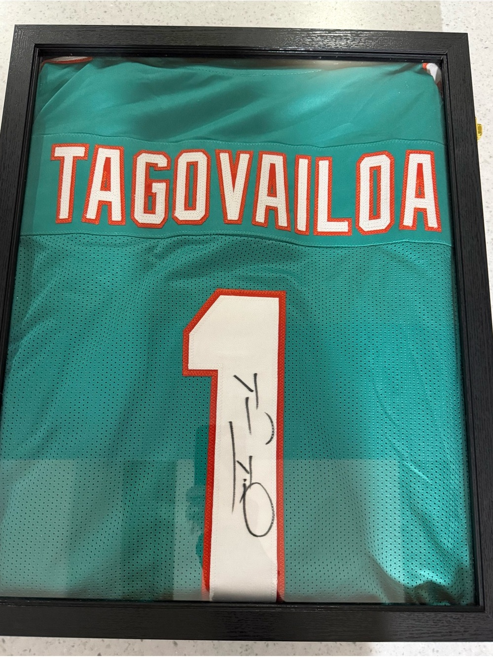 Tua Tagovailoa Autographed Dolphins Jersey with Certificate Tag